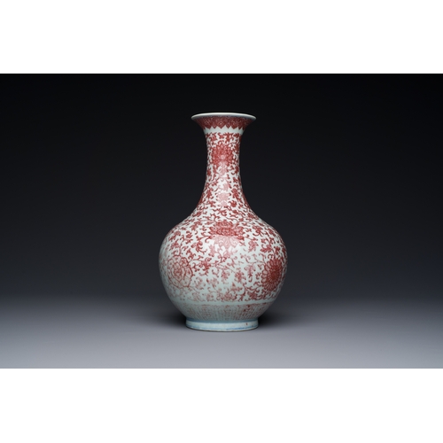 132 - A Chinese copper-red bottle vase with floral scrolls, QianlongDescription:H.: 30,5 cm Provenance: Th... 