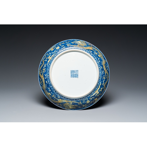 135 - A Chinese blue-ground yellow-enamelled 'dragon' dish, Qianlong mark and of the periodDescription:Dia... 