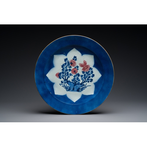 140 - Three large Chinese blue, white and copper-red powder-blue-ground dishes with floral design, KangxiD... 