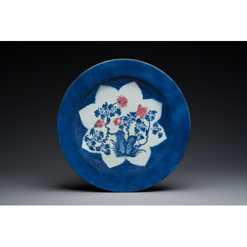 140 - Three large Chinese blue, white and copper-red powder-blue-ground dishes with floral design, KangxiD... 