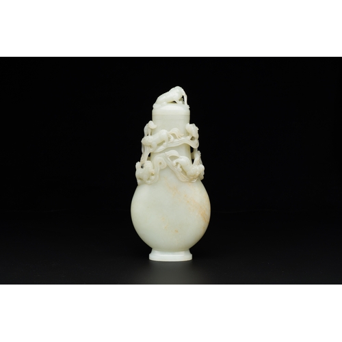 161 - A fine Chinese white jade 'buddhist lions' vase and cover, QingDescription:H.: 25,5 cm Provenance:- ... 