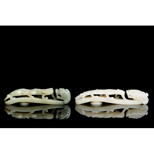 164 - Two Chinese white and celadon jade belt hooks, QingDescription:L.: 13,5 cm (the largest) Provenance:... 