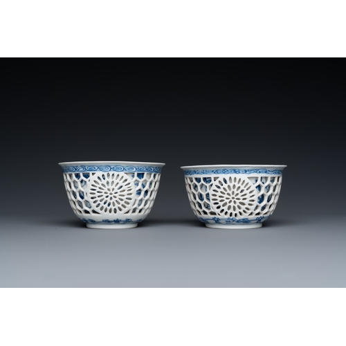 204 - A pair of Chinese blue and white reticulated double-walled cups and saucers, KangxiDescription:Dia.:... 