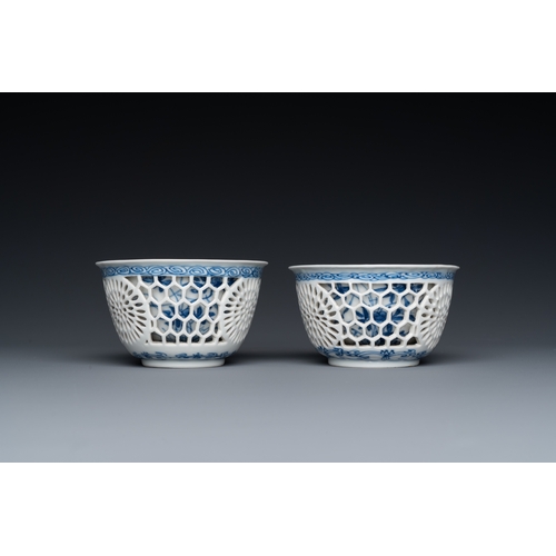 204 - A pair of Chinese blue and white reticulated double-walled cups and saucers, KangxiDescription:Dia.:... 