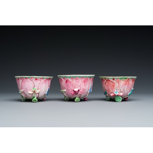 226 - Three Chinese relief-decorated famille rose 'lotus' cups and saucers with a scholar and his servant,... 