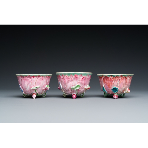 226 - Three Chinese relief-decorated famille rose 'lotus' cups and saucers with a scholar and his servant,... 