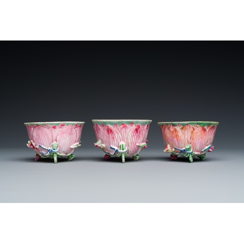 226 - Three Chinese relief-decorated famille rose 'lotus' cups and saucers with a scholar and his servant,... 