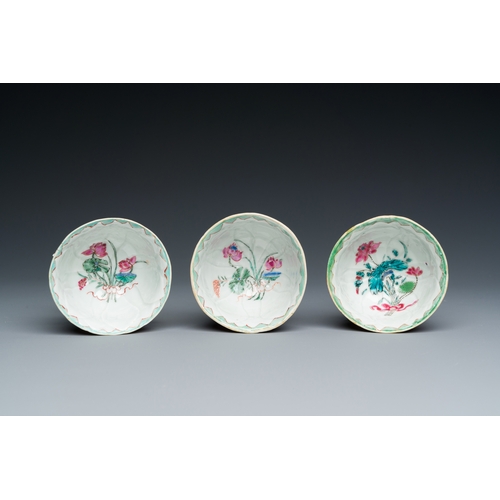 226 - Three Chinese relief-decorated famille rose 'lotus' cups and saucers with a scholar and his servant,... 