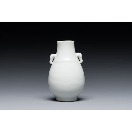 233 - A small Chinese Dehua blanc de Chine elephant-handled 'hu' vase, 18th C.Description:H.: 8 cmConditio... 