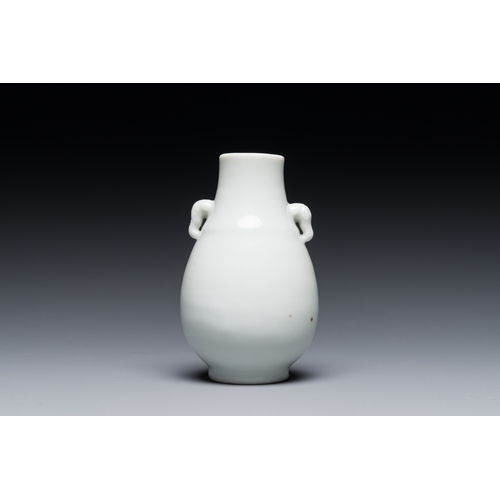 233 - A small Chinese Dehua blanc de Chine elephant-handled 'hu' vase, 18th C.Description:H.: 8 cmConditio... 