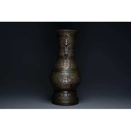 254 - An imposing Chinese archaistic gold-and-silver-inlaid bronze 'hu' vase on wooden stand inscribed Tao... 