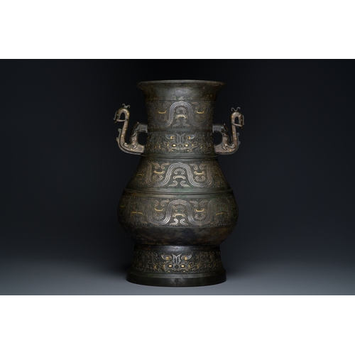 254 - An imposing Chinese archaistic gold-and-silver-inlaid bronze 'hu' vase on wooden stand inscribed Tao... 