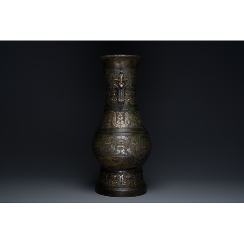 254 - An imposing Chinese archaistic gold-and-silver-inlaid bronze 'hu' vase on wooden stand inscribed Tao... 