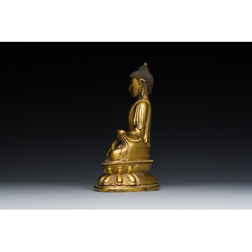 259 - A Sino-Tibetan gilt bronze Medicine Buddha or Bhaishajyaguru, 16th C.Description:H.: 17 cm Weight: 1... 