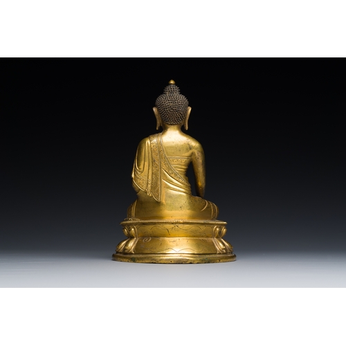 259 - A Sino-Tibetan gilt bronze Medicine Buddha or Bhaishajyaguru, 16th C.Description:H.: 17 cm Weight: 1... 