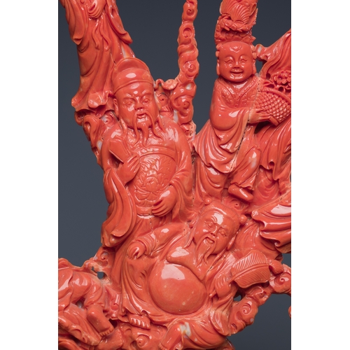 265 - A large Chinese red coral 'Baxian' group, 19/20th C.Description:H 45 - L 38 cm (incl. stand) Weight:... 