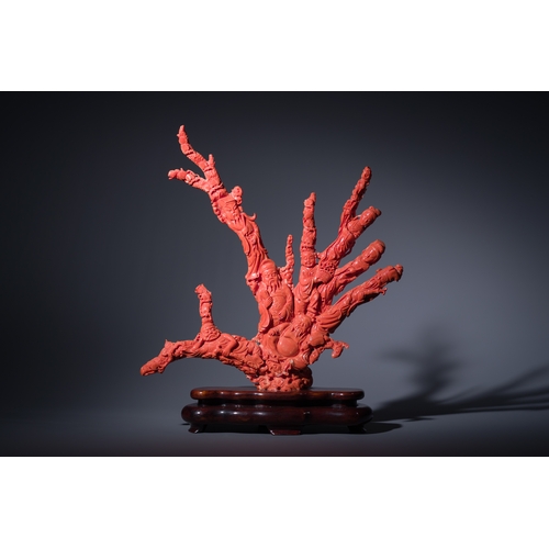 265 - A large Chinese red coral 'Baxian' group, 19/20th C.Description:H 45 - L 38 cm (incl. stand) Weight:... 