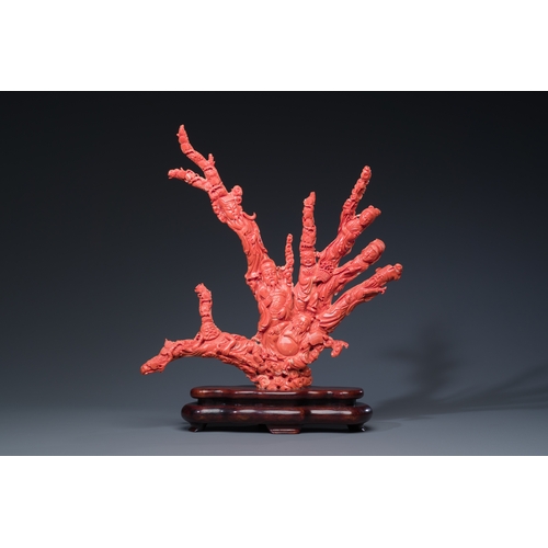 265 - A large Chinese red coral 'Baxian' group, 19/20th C.Description:H 45 - L 38 cm (incl. stand) Weight:... 