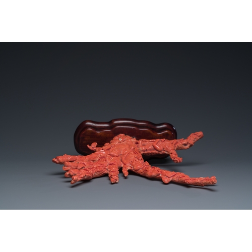 265 - A large Chinese red coral 'Baxian' group, 19/20th C.Description:H 45 - L 38 cm (incl. stand) Weight:... 