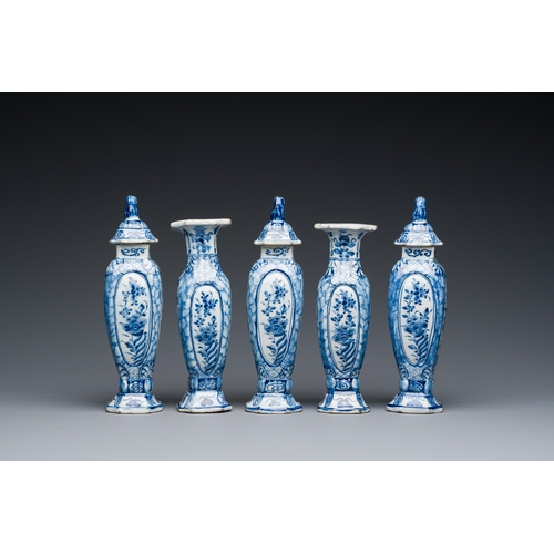 349 - A small blue and white Dutch Delft garniture of five vases, 18th C.Description:H.: 18 cm (tallest va... 