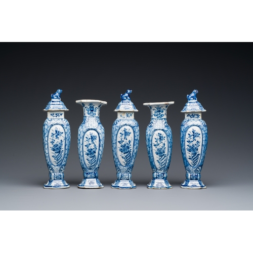 349 - A small blue and white Dutch Delft garniture of five vases, 18th C.Description:H.: 18 cm (tallest va... 