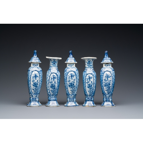 349 - A small blue and white Dutch Delft garniture of five vases, 18th C.Description:H.: 18 cm (tallest va... 