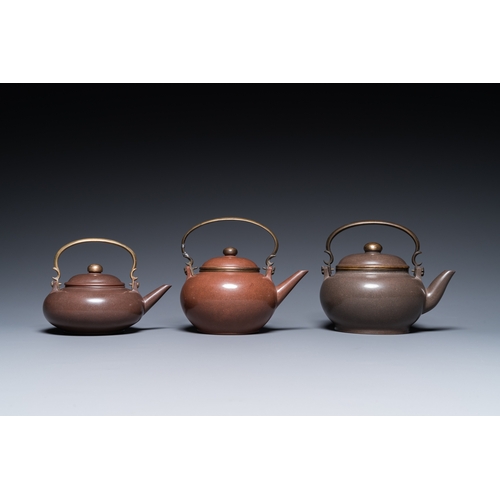 28 - Three Chinese polished Yixing stoneware teapots and covers for the Thai market, Gong Ju è´¡å± mark,... 