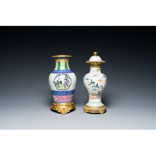 38 - A Chinese famille verte vase and an enamelled Yixing stoneware vase with gilt bronze mounts, 19th C.... 