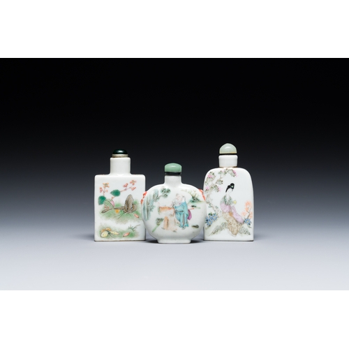 69 - Three Chinese famille rose snuff bottles, one marked Yongzheng, 19th C.Description:H.: 9 cm (the tal... 