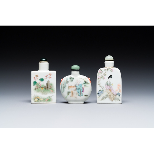 69 - Three Chinese famille rose snuff bottles, one marked Yongzheng, 19th C.Description:H.: 9 cm (the tal... 