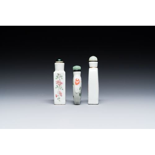 69 - Three Chinese famille rose snuff bottles, one marked Yongzheng, 19th C.Description:H.: 9 cm (the tal... 