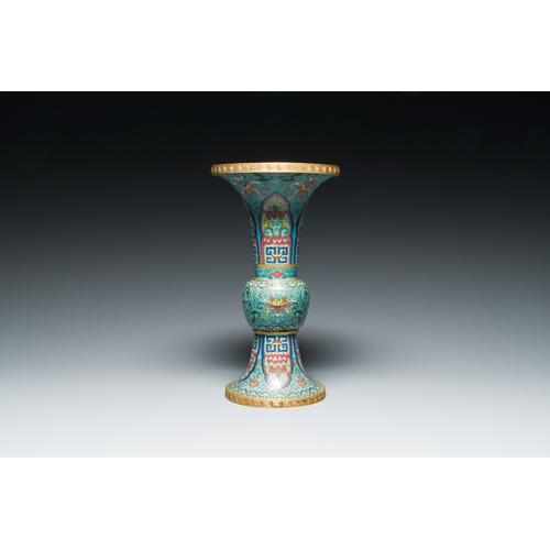 113 - A Chinese cloisonne 'gu' vase with lotus scrolls, 18/19th C.Description:H.: 32 cmCondition reports:P... 