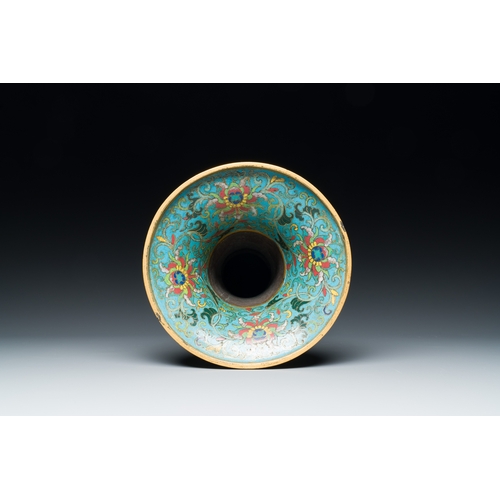 113 - A Chinese cloisonne 'gu' vase with lotus scrolls, 18/19th C.Description:H.: 32 cmCondition reports:P... 