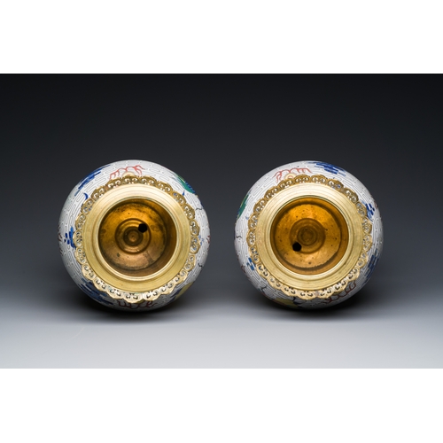 115 - A pair of Chinese white-ground cloisonne 'dragon' vases with gilt bronze mounts, 19th C.Description:... 