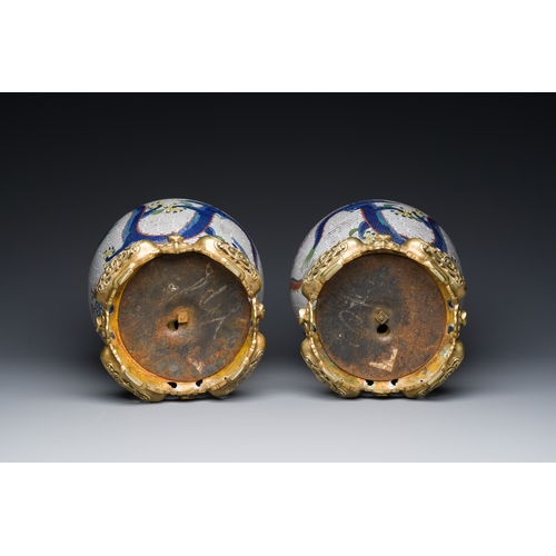 115 - A pair of Chinese white-ground cloisonne 'dragon' vases with gilt bronze mounts, 19th C.Description:... 