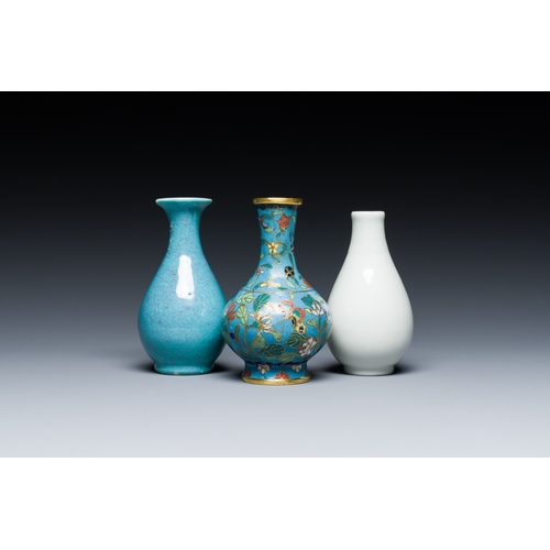 118 - Three small Chinese bottle vases in cloisonne, white and robin's-egg-glazed porcelain, 19/20th C.Des... 