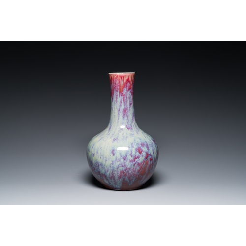 119 - A Chinese flambe-glazed bottle vase, 19th C.Description:H.: 39 cm (the vase)H.: 42 cm (incl. the sta... 