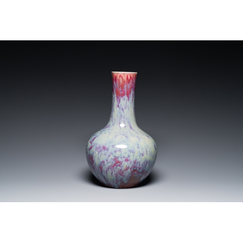 119 - A Chinese flambe-glazed bottle vase, 19th C.Description:H.: 39 cm (the vase)H.: 42 cm (incl. the sta... 