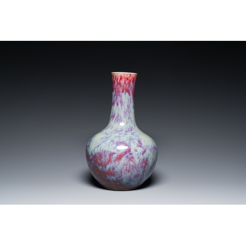 119 - A Chinese flambe-glazed bottle vase, 19th C.Description:H.: 39 cm (the vase)H.: 42 cm (incl. the sta... 