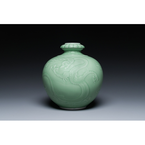 121 - A Chinese monochrome celadon-glazed 'dragon' vase, 19th C.Description:H.: 21,5 cm Provenance:- A Bel... 