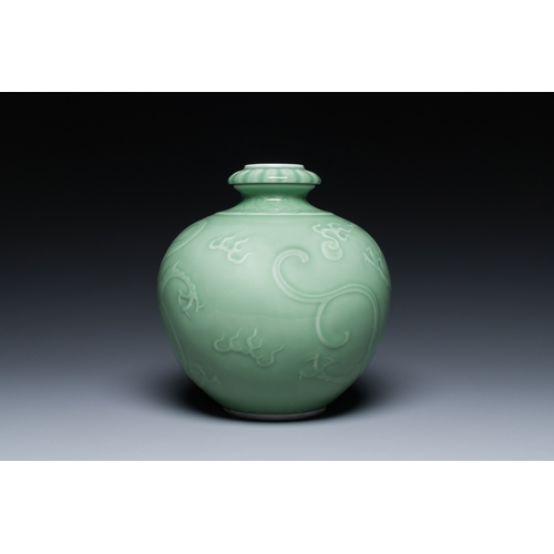 121 - A Chinese monochrome celadon-glazed 'dragon' vase, 19th C.Description:H.: 21,5 cm Provenance:- A Bel... 