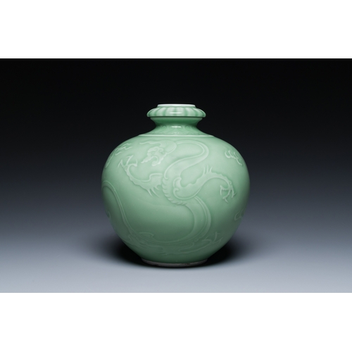 121 - A Chinese monochrome celadon-glazed 'dragon' vase, 19th C.Description:H.: 21,5 cm Provenance:- A Bel... 