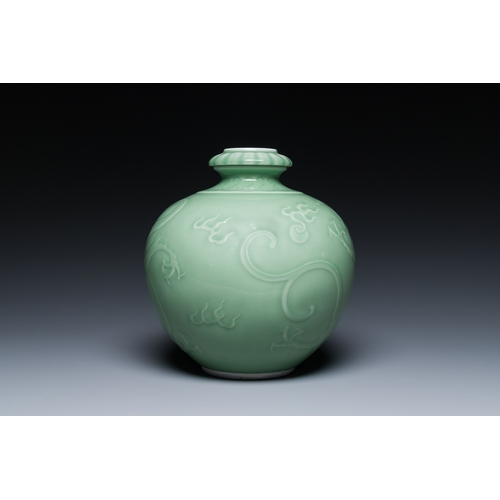 121 - A Chinese monochrome celadon-glazed 'dragon' vase, 19th C.Description:H.: 21,5 cm Provenance:- A Bel... 