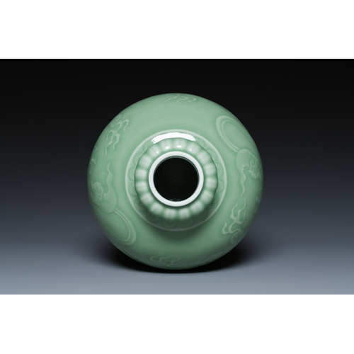 121 - A Chinese monochrome celadon-glazed 'dragon' vase, 19th C.Description:H.: 21,5 cm Provenance:- A Bel... 