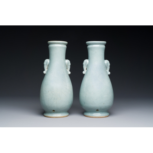 134 - A pair of Chinese monochrome lavender-blue-glazed 'hu' vases, 19th C.Description:H.: 23,5 cmConditio... 