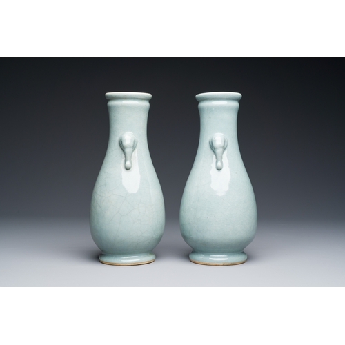 134 - A pair of Chinese monochrome lavender-blue-glazed 'hu' vases, 19th C.Description:H.: 23,5 cmConditio... 