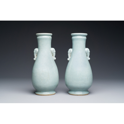 134 - A pair of Chinese monochrome lavender-blue-glazed 'hu' vases, 19th C.Description:H.: 23,5 cmConditio... 