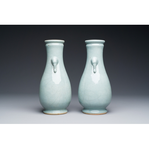 134 - A pair of Chinese monochrome lavender-blue-glazed 'hu' vases, 19th C.Description:H.: 23,5 cmConditio... 