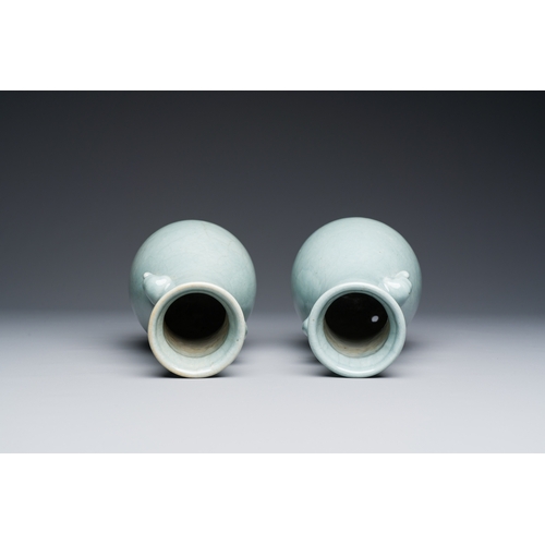 134 - A pair of Chinese monochrome lavender-blue-glazed 'hu' vases, 19th C.Description:H.: 23,5 cmConditio... 