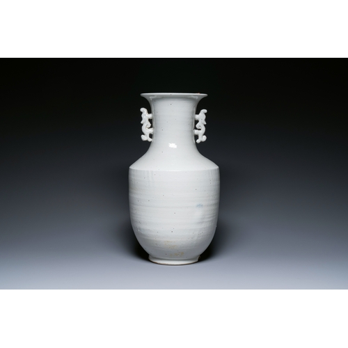 146 - A Chinese white-glazed vase on wooden stand, 19th C.Description:H.: 51,5 cm (the vase)H.: 70,5 cm (i... 